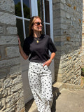 Pantalon fluide pois noirs fond blanc ANDY taille haute – Marcelle Ouest porté par Alison